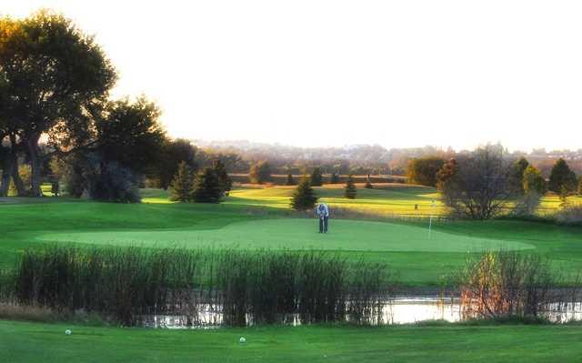 A view of a green with water coming into play at Prairie West Colf Course