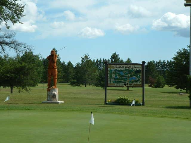 A sunny day view from the practice putting green at Babbitt Golf Course
