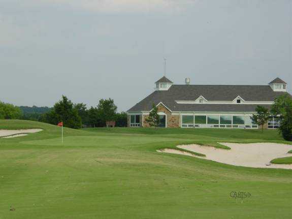 A view of green #18 and clubhouse in background at Tangle Ridge Golf Club