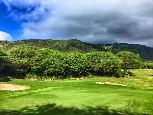 A view of a green protected by bunkers at Kahili Golf Course
