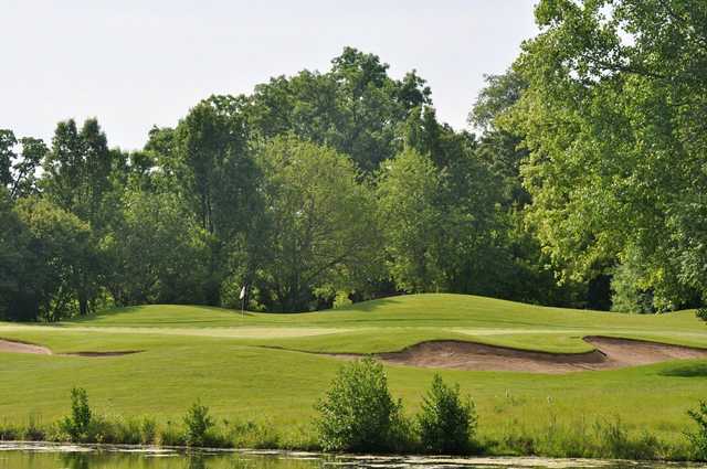 View of a green and bunker at Chalet Hills Golf Club