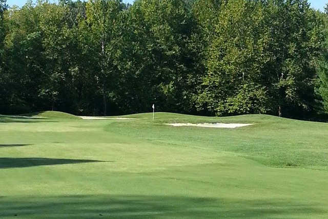 A view of hole #17 guarded by bunkers at Fox Creek Golf Club.