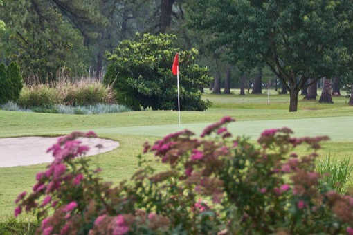 A view of a green protected by sand traps at Kinston Country Club