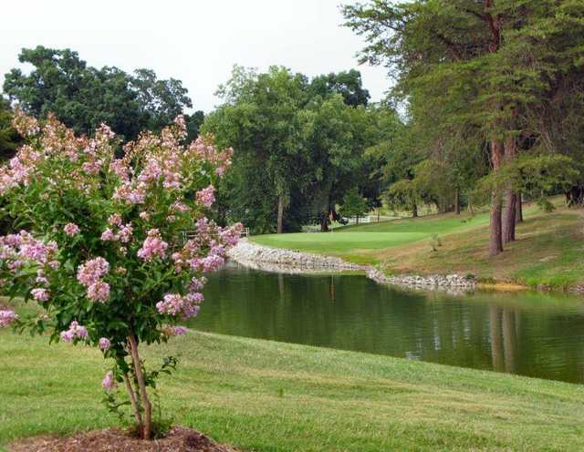 A view of a green with water coming into play at Glen Oaks Golf Club