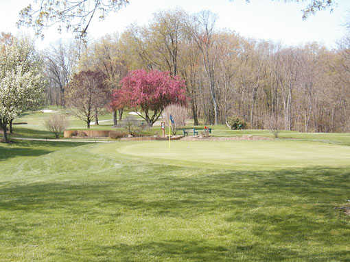 A spring day view of a green at Yankee Run Golf Course