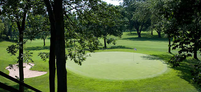 A sunny day view of a green at Moundbuilders Country Club