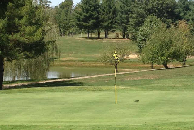 A view of a hole with water in background at Meigs Golf Course.