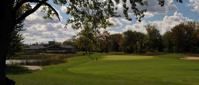 View of a green and clubhouse at Currie Municipal Golf Course