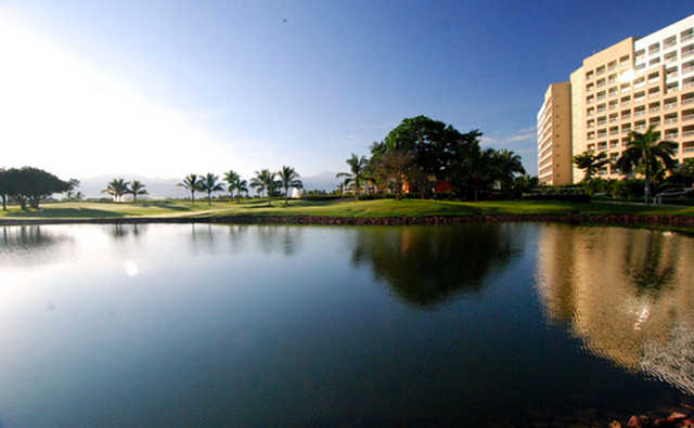 A view of a green surrounded by water from The Nicklaus Design Course at Vidanta Nuevo Vallarta