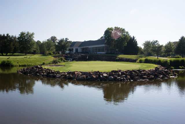 A view of a green with water coming into play at Virginia Oaks Golf Club