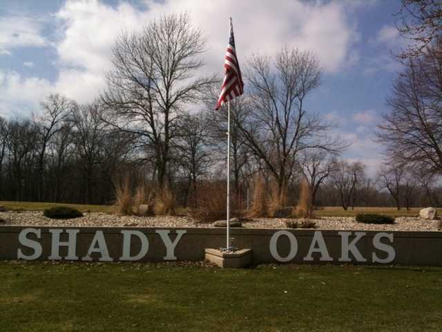 A view of the entrance sign at Shady Oaks Country Club
