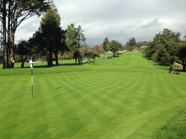 A sunny day view of a hole at Pasatiempo Golf Club