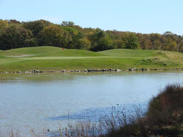 A view of a green over the water at Heritage Bluffs Public Golf Club