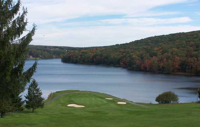 A view of a green with water and bunkers coming into play at Alpine Lake Resort