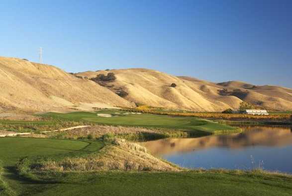 A view of a green with water on the right at The Course at Wente Vineyards