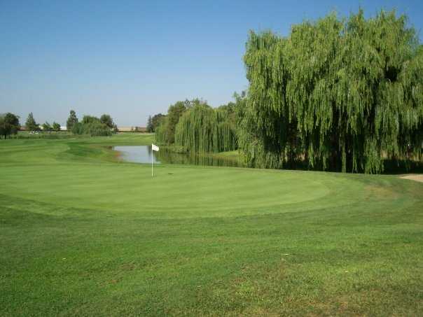 A view of a green with water in background at Micke Grove Golf Links.