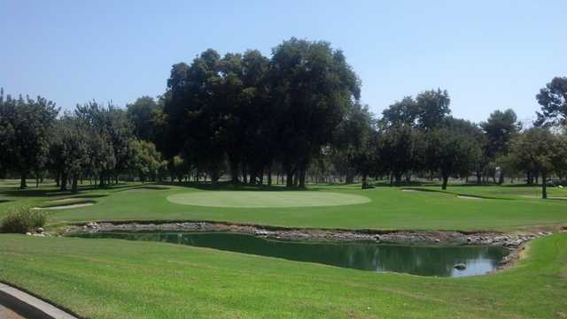 A view of a hole with bunkers on the left at El Dorado Park Golf Club.