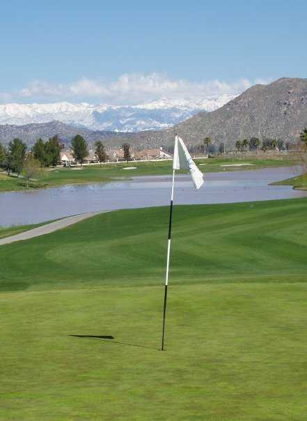 A view of a hole with water in background at Menifee Lakes Country Club