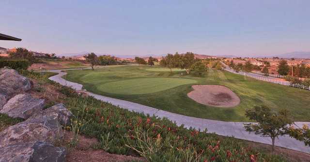 A view of a hole with a bunker on the right and narrow road in foreground at The Golf Club from Rancho California