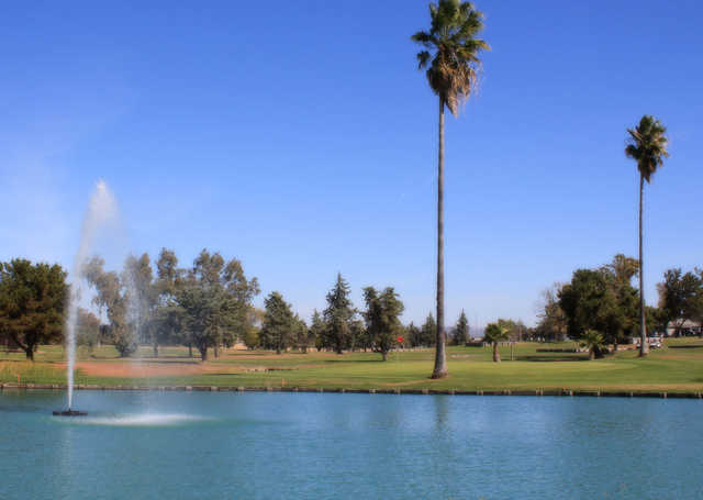 A green view with water in foreground at Table Mountain Golf Club