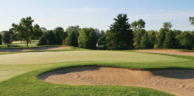 A view of a green protected by tricky bunkers at Moccasin Creek Country Club.