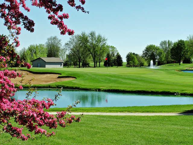 A spring day view over a pond at Fox Valley Golf Club