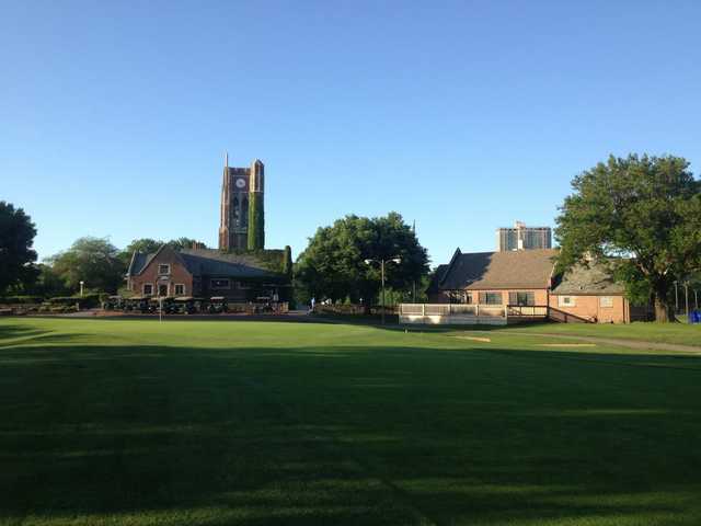 A view of a green and the clock tower cafe in background at Sydney R. Marovitz Golf Course