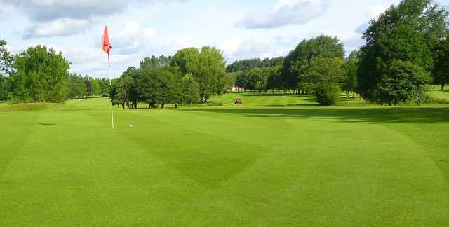 A sunny day view of a hole from Lymm Golf Club