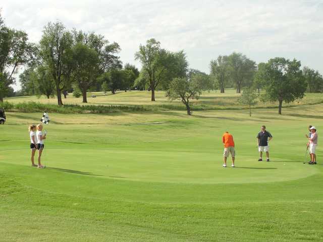 A sunny day view of a green at Arkansas City Country Club