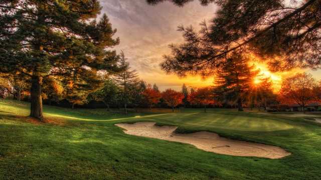 Sunset view of a green at The Country Club at Woodmoor