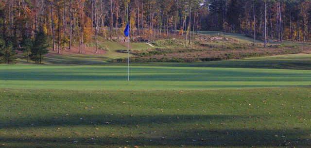 A fall day view of a green at UNC Finley Golf Course