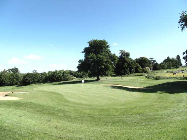 A view of a hole protected by bunkers at Overstone Park Golf Club