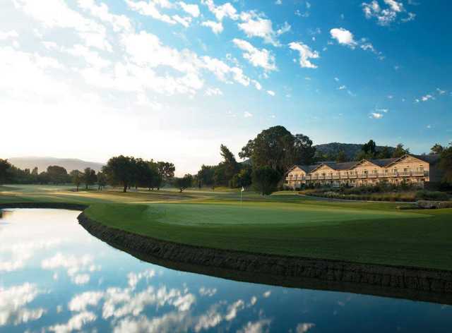 A view of a green surrounded by water at Temecula Creek Inn Golf Resort