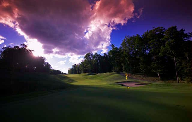 Sunset over the 18th hole at The Cedar River at Shanty Creek