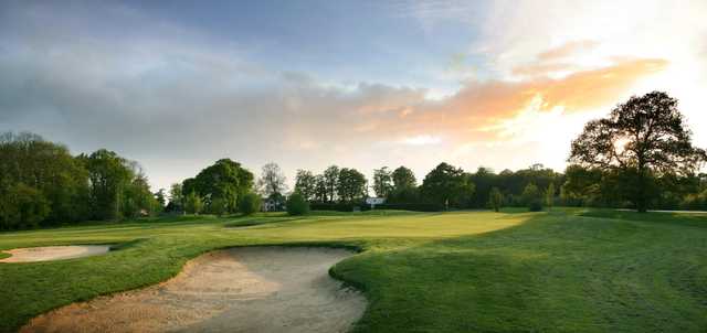Sunset view of a green at Redlibbets Golf Club