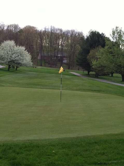 A spring day view of a green at Foxburg Country Club