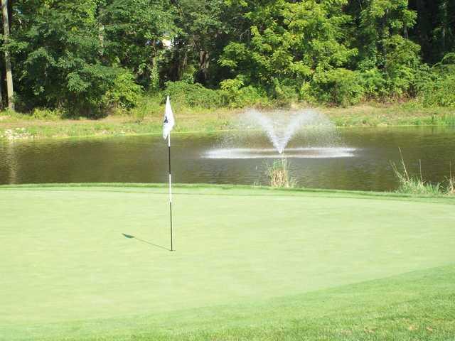 A view of a green with water coming into play at Hickory Valley Golf Club