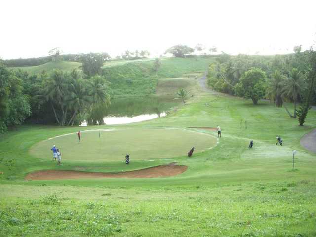 A view of a hole with bunkers, water and rocks coming into play at Country Club of the Pacific