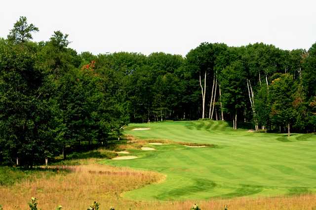 The par-4 13th hole is a long, uphill dogleg left at Black Lake Golf Club
