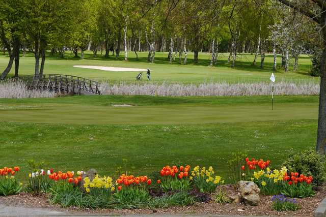 A spring day view of a green at 18-hole Course from Schmitzhof Golf & Country Club