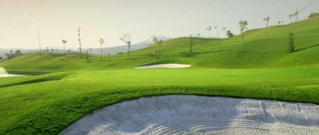 A view of a hole protected by sand traps at Magna Marbella Golf
