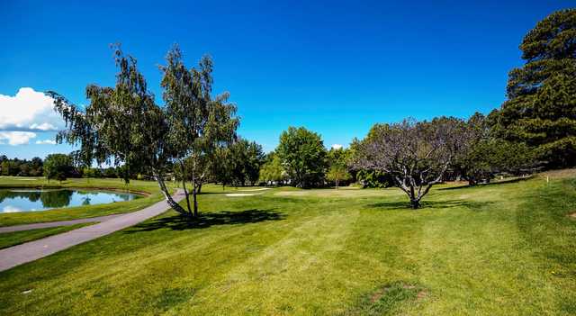 A warm day view of a well protected hole at Continental Country Club