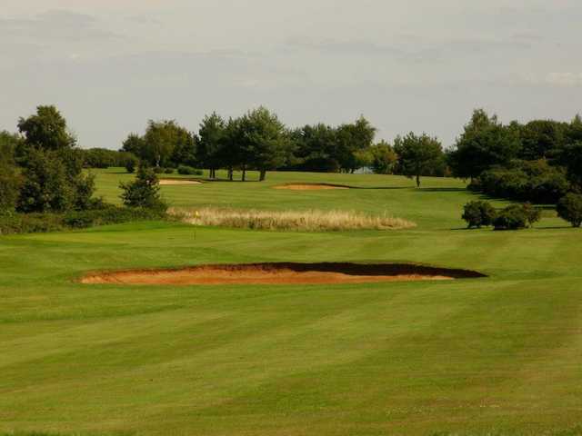 Green and bunkers at Rye Hill Golf Club