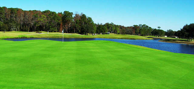 A view of a green with water coming into play at Lansbrook Golf Club
