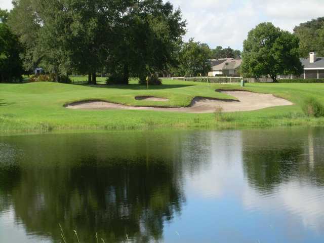 A view of a green with water and bunkers coming into play at Wekiva Golf Club