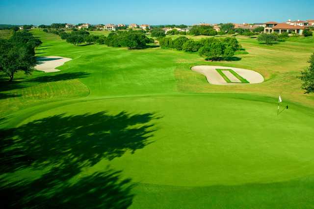 A warm sunny day view of a hole at Falconhead Golf Club