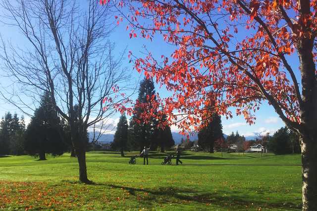 A fall day view of a fairway at Crown Isle Golf Course