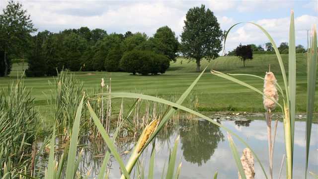 View of a green over water at Haverhill Golf Club