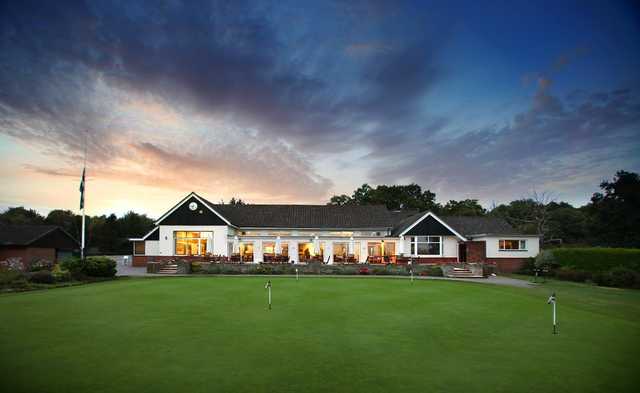 A view of the clubhouse and practice area at Stoneham Golf Club