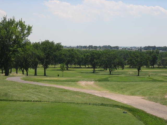 A view of green #3 with narrow road in foreground at Quail Dunes Golf Course